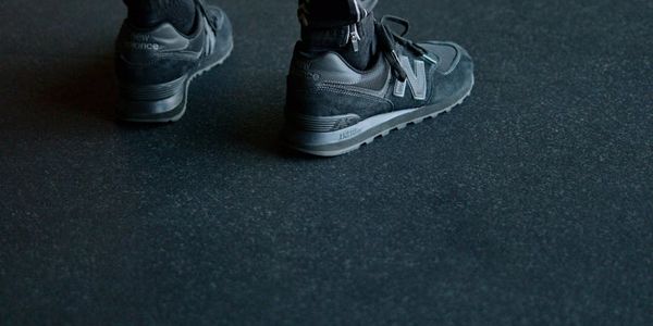 Athletic sneakers on a dark floor in a gym